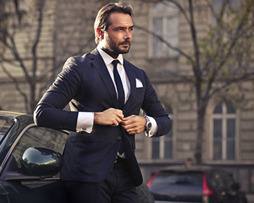 Smartly dressed professional chauffeur in London